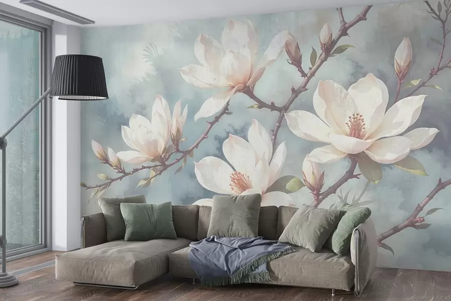 wall murals White magnolia flowers blooming on tree branches against a soft, blurred textured blue background w08383