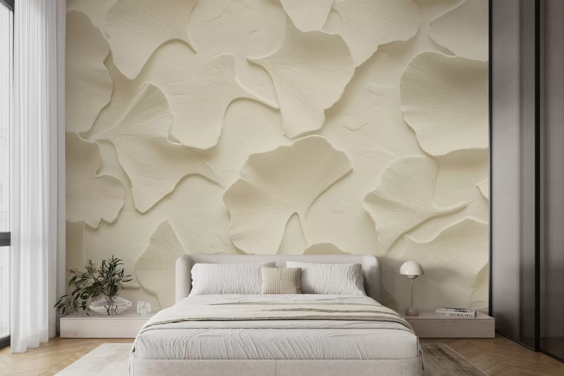 wall murals Stucco with delicate embossing of ginkgo leaves on a soft beige background w08560