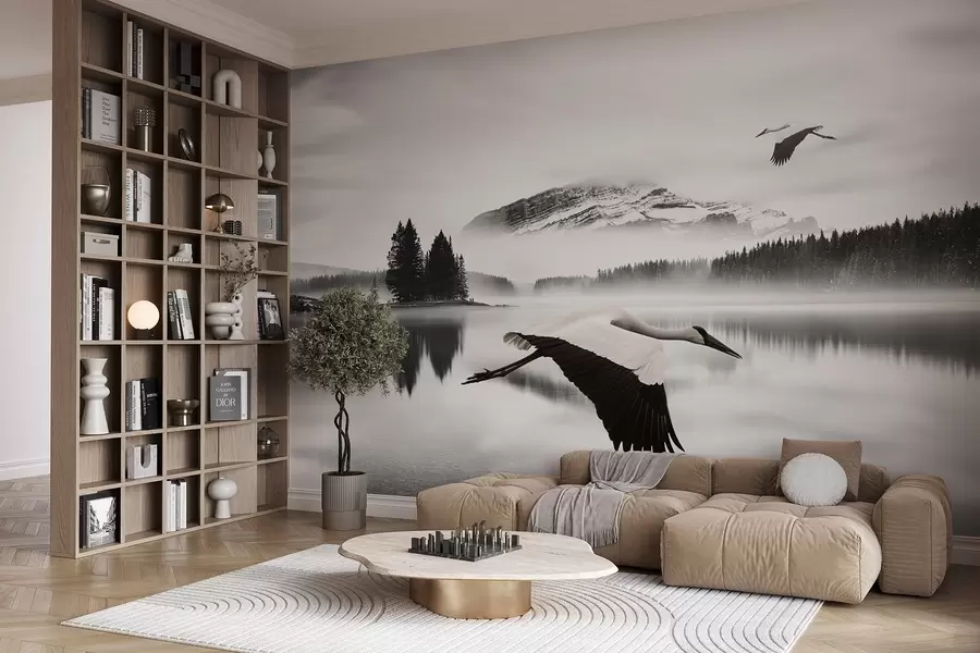 wall murals A stork in flight over a river and mountains, black-and-white landscape with birds w08658