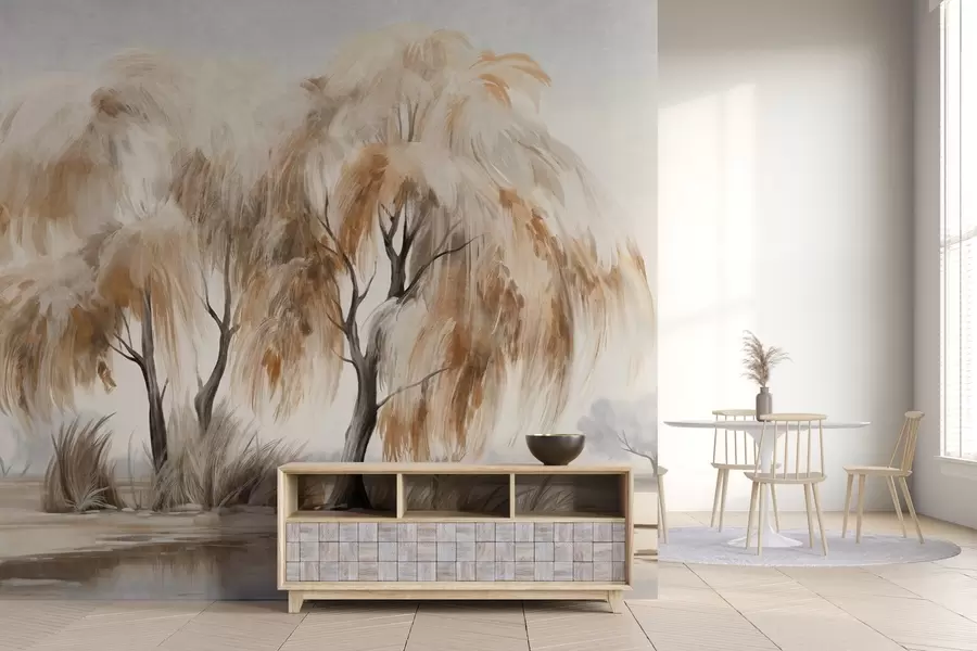 wall murals Textured willow trees with brown and white leaves on the shore of a lake, with some grass around them, in a misty day w09268