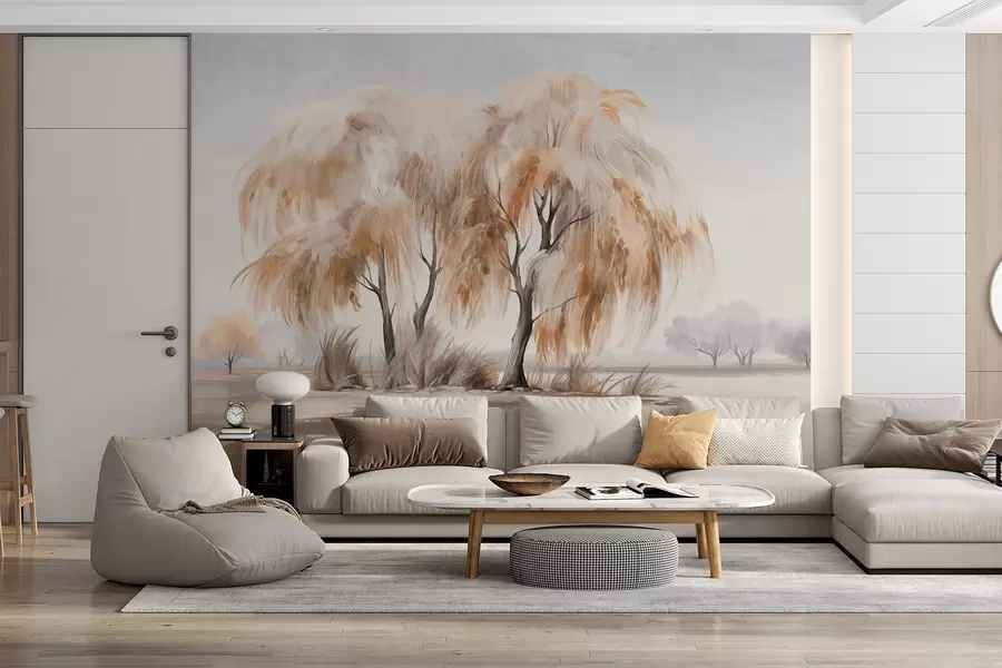 wall murals Textured willow trees with brown and white leaves on the shore of a lake, with some grass around them, in a misty day w09268