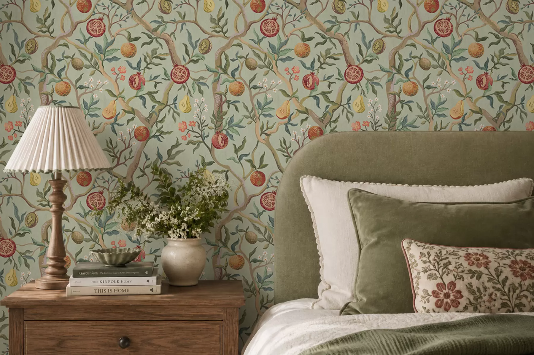 wall murals Pomegranate fruits, pears and flowers on a pale green background a00465