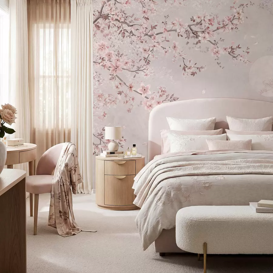 wall murals Pink blossoms on a branch above a soft mountain scene w05695v1