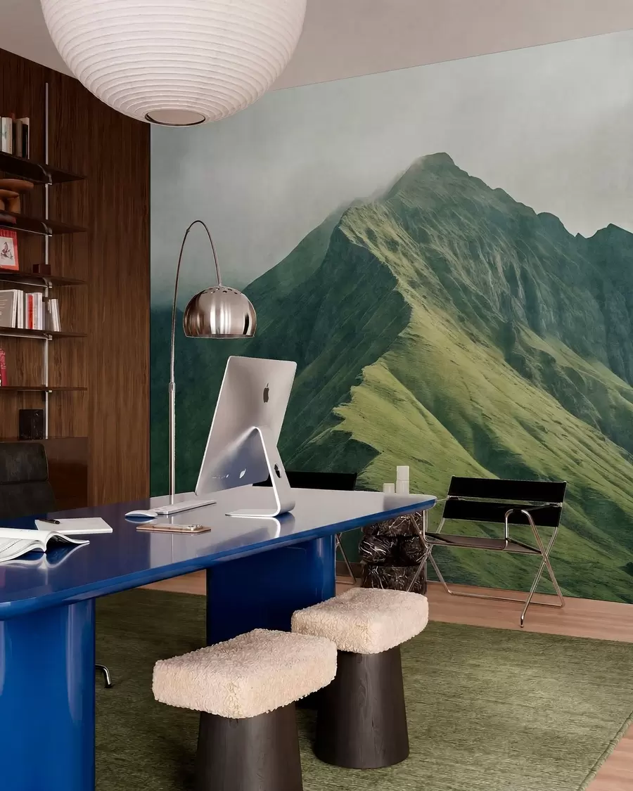 wall murals Mountain malachite with green slopes and a peak wrapped in soft mist w05820